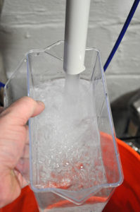 Filling the specimen cup with RODI water.