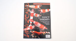 The cover for the July/August 2015 issue of AMAZONAS Magazine, featuring Fancy Shrimps, Desktop Planted Tanks, Dynamic Danios, and Charismatic Rainbowfish