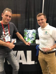 John Pini (right) stands with aquascaping mogul Oliver Knott and Pini's winning aquascape. A thumbs up from Knott says it all.