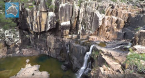 Could Puzzle Creek, a tributary to the Running River noted for rugged terrain and waterfalls, serve to protect outplanted popluations of Running River Rainbowfish?