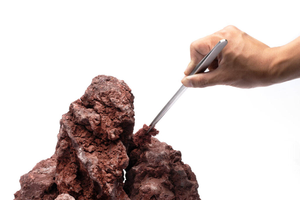 STEP 2: Pinch and pack Controlock between hardscape